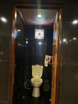a bathroom with a toilet in a small room at Chang Hostel Patong Phuket in Patong Beach