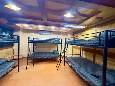 a room with three bunk beds in it at Chang Hostel Patong Phuket in Patong Beach