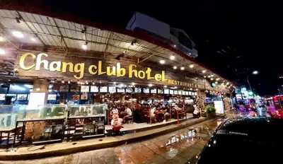 a chong club hut with people sitting outside at night at Chang Hostel Patong Phuket in Patong Beach