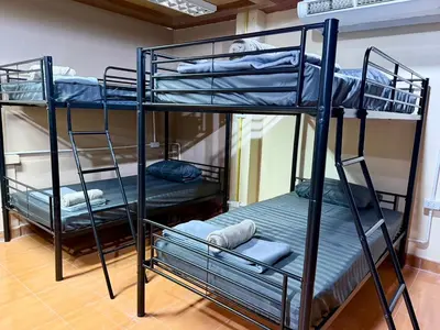 a couple of bunk beds in a room at Chang Hostel Patong Phuket in Patong Beach