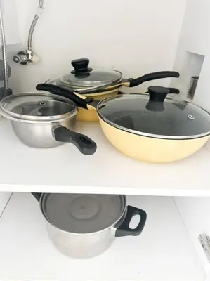 a kitchen counter with several pots and pans on it at 2bedrooms Cassia Residence lake view in Phuket