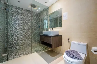 a bathroom with a shower and a toilet and a sink at Minuets 2 Patong Beach Twin Sand Resort & Spa! C152 in Patong Beach