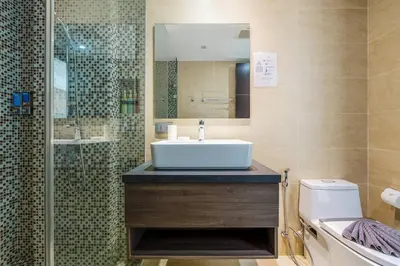 a bathroom with a sink and a shower at Minuets 2 Patong Beach Twin Sand Resort & Spa! C152 in Patong Beach