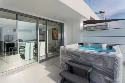 a bathroom with a jacuzzi tub in a house at Kata Beach TheView luxurious Condonomium in Kata Beach