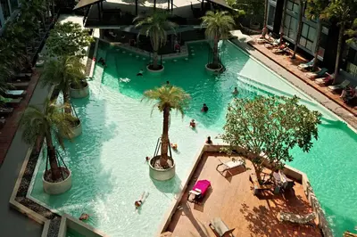 an overhead view of a swimming pool with people in it at City Gate Kamala N103 by Phuket Sabay Rent in Kamala Beach