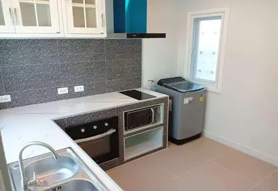 a kitchen with a sink and a dishwasher at Cozy House by Cody One in Thalang