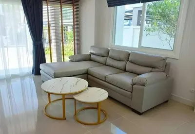 a living room with a couch and two tables at Cozy House by Cody One in Thalang