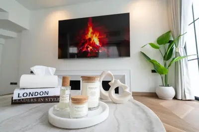 a room with a fireplace with products on a table at House 158 Patong Pool Villa 4BR Near Beach in Patong Beach