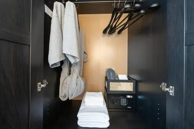 a bathroom with a toilet with a toaster and towels at House 158 Patong Pool Villa 4BR Near Beach in Patong Beach