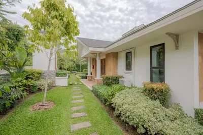 a house with a walkway in front of it at Golden Horizon Villa 02 in Ban Ao Kung