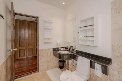 a bathroom with a toilet and a sink at Golden Horizon Villa 02 in Ban Ao Kung