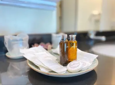 two bottles of oil on a plate on a kitchen counter at Golden Horizon Villa 02 in Ban Ao Kung
