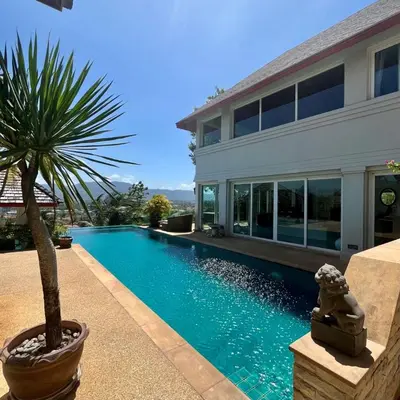 a swimming pool in front of a house at 30 - Panoramic View Villa in Thalang in Thalang