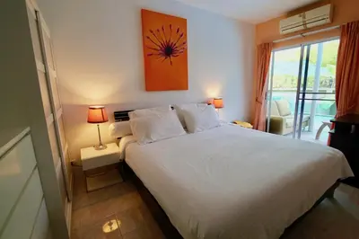 a bedroom with a large white bed and a window at 3 bedrooms Semi-Detached with Pool near Kamala Beach in Kamala Beach