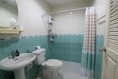 a bathroom with a toilet and a sink and a mirror at 3 bedrooms Semi-Detached with Pool near Kamala Beach in Kamala Beach