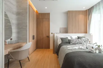 a bedroom with two white swans on a bed at Nature's Rest Private Pool Villa Rawai in Phuket Town