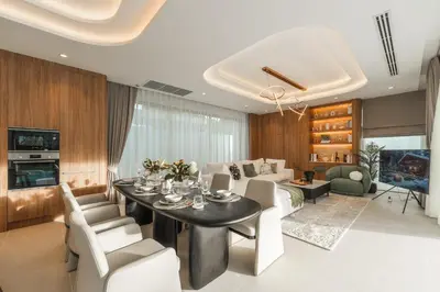 a dining room and living room with a table and chairs at Nature's Rest Private Pool Villa Rawai in Phuket Town