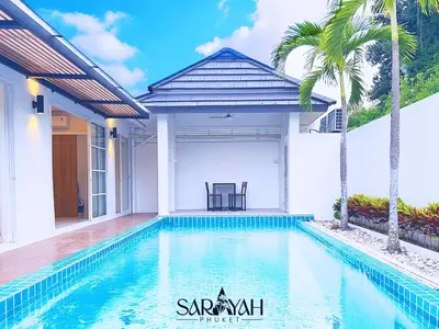 a swimming pool in front of a villa at Sarayah Phuket Pool Villa in Phuket Town