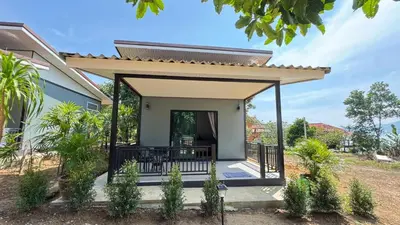 a home with a porch with a roof at Relax sunsmile Kohyaonoi in Ko Yao Noi