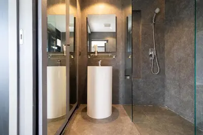 a bathroom with two sinks and a shower at CityGate Kamala in Kamala Beach