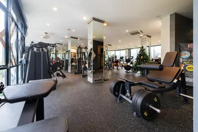 a gym with tread machines and a christmas tree at CityGate Kamala in Kamala Beach