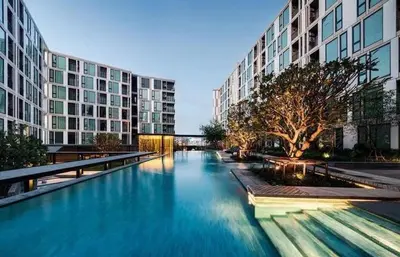 a large pool of blue water in front of buildings at the base updown\u4e00\u5367 in Phuket Town