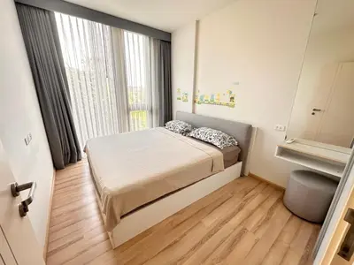 a small bedroom with a bed and a window at the base updown\u4e00\u5367 in Phuket Town