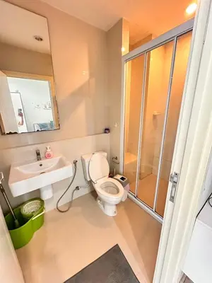 a bathroom with a toilet and a sink and a shower at the base updown\u4e00\u5367 in Phuket Town