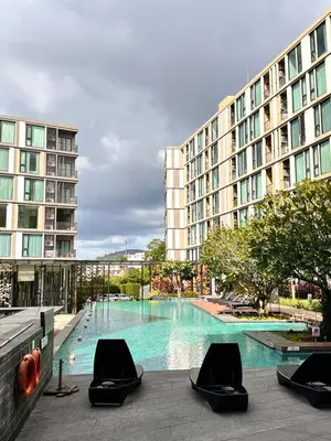 a swimming pool in front of a large building at the base updown\u4e00\u5367 in Phuket Town