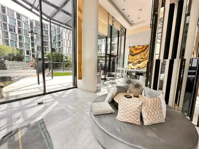 a lobby with a round table in a building with windows at the base updown\u4e00\u5367 in Phuket Town