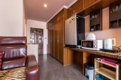a living room with a couch and a microwave at Condopatong in Patong Beach