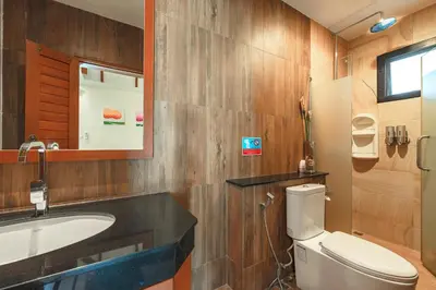 a bathroom with a toilet and a sink and a mirror at 3 Bedrooms villa walking distance to Rawai beach in Rawai Beach