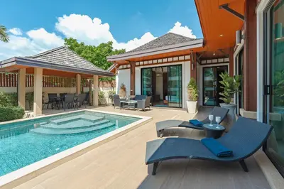 a house with a swimming pool and a patio at 3 Bedrooms villa walking distance to Rawai beach in Rawai Beach