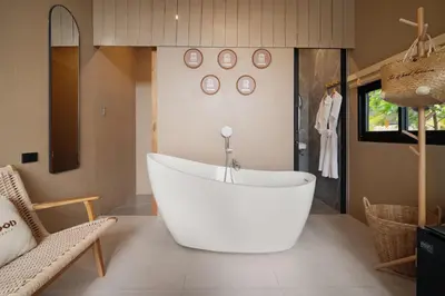 a large white bath tub in a bathroom at The Wood Terrace in Ban Chin Tham Mai