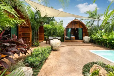 a backyard with a wooden building and a swimming pool at Tropical Chalet-Style 2BR Villa with Pool Pasak Paradise 2, Bangtao in Bang Tao Beach