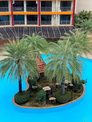 a model of a hotel with palm trees and tables at Cozy Room Phuket in Ban Mai Salae