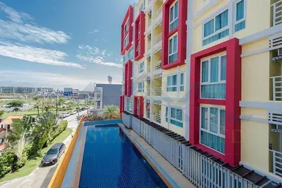 an apartment building with a swimming pool on the balcony at Bukitta Airport Condominium by Sutanee in Ban Bo Han