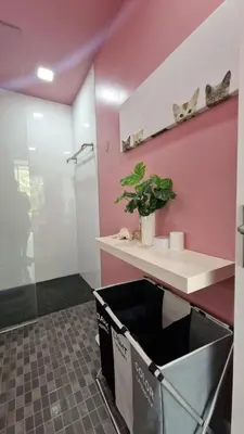 a bathroom with a pink wall and a sink at Просторная квартира с одной спальней in Kamala Beach