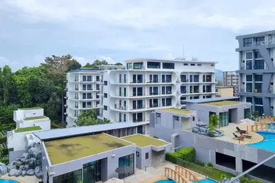 an aerial view of apartment buildings with a pool at Perfect Holiday Spot - Pool View Duplex in Tropical Naiharn! UTL A310 in Rawai Beach