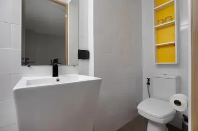 a white bathroom with a sink and a toilet at Perfect Holiday Spot - Pool View Duplex in Tropical Naiharn! UTL A310 in Rawai Beach