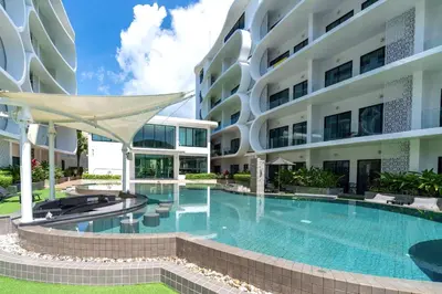 a swimming pool in front of a building at Perfect Holiday Spot - Pool View Duplex in Tropical Naiharn! UTL A310 in Rawai Beach