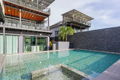 a swimming pool in the middle of a house at Kathu V pool villa 171 in Kathu