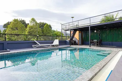 a large swimming pool on top of a building at Kathu V pool villa 171 in Kathu
