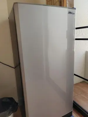 a white refrigerator in a kitchen with its door open at L&K2023 Residence in Patong Beach