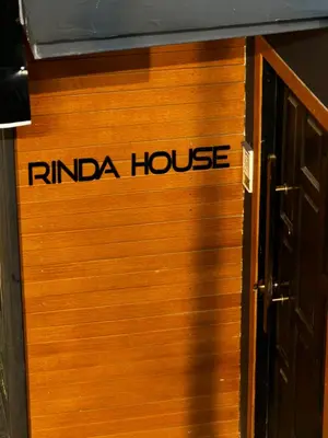 a wooden door with the words rindia house on it at Rinda House Patong 31-1 in Patong Beach