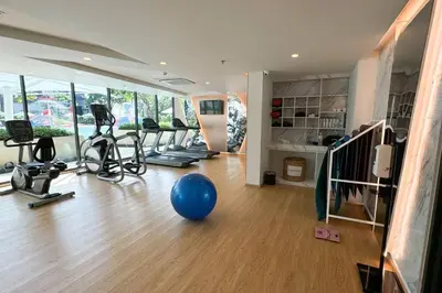 a gym with a bunch of exercise bikes and a blue ball at 5 Star La Vita Studio Rawai 702 in Phuket Town