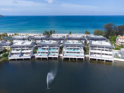 an aerial view of a marina with boats in the water at Beachfront 3BR Penthouse with Private Rooftop Pool - Laguna, BangTao in Phuket Town
