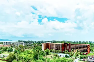 a view of a city with buildings and trees at Tropical Bliss, Relax & Enjoy at 1BR Apartment MBC near Mai Khao Beach! in Mai Khao Beach