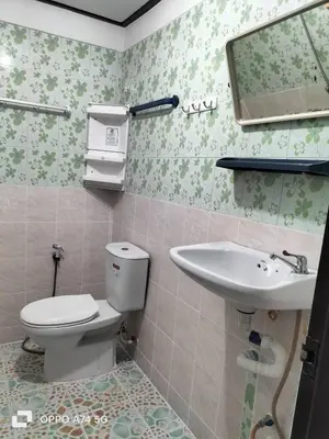 a bathroom with a toilet and a sink at Alanta aonang resort in Ban Khlong Haeng