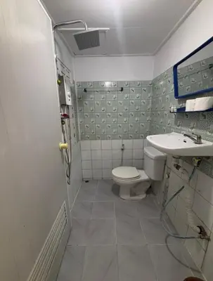 a bathroom with a toilet and a sink at Alanta aonang resort in Ban Khlong Haeng